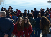 Baku residents bringing flowers to Seaside Boulevard to honor missing oil workers.  Azerbaijan, Dec.07, 2015